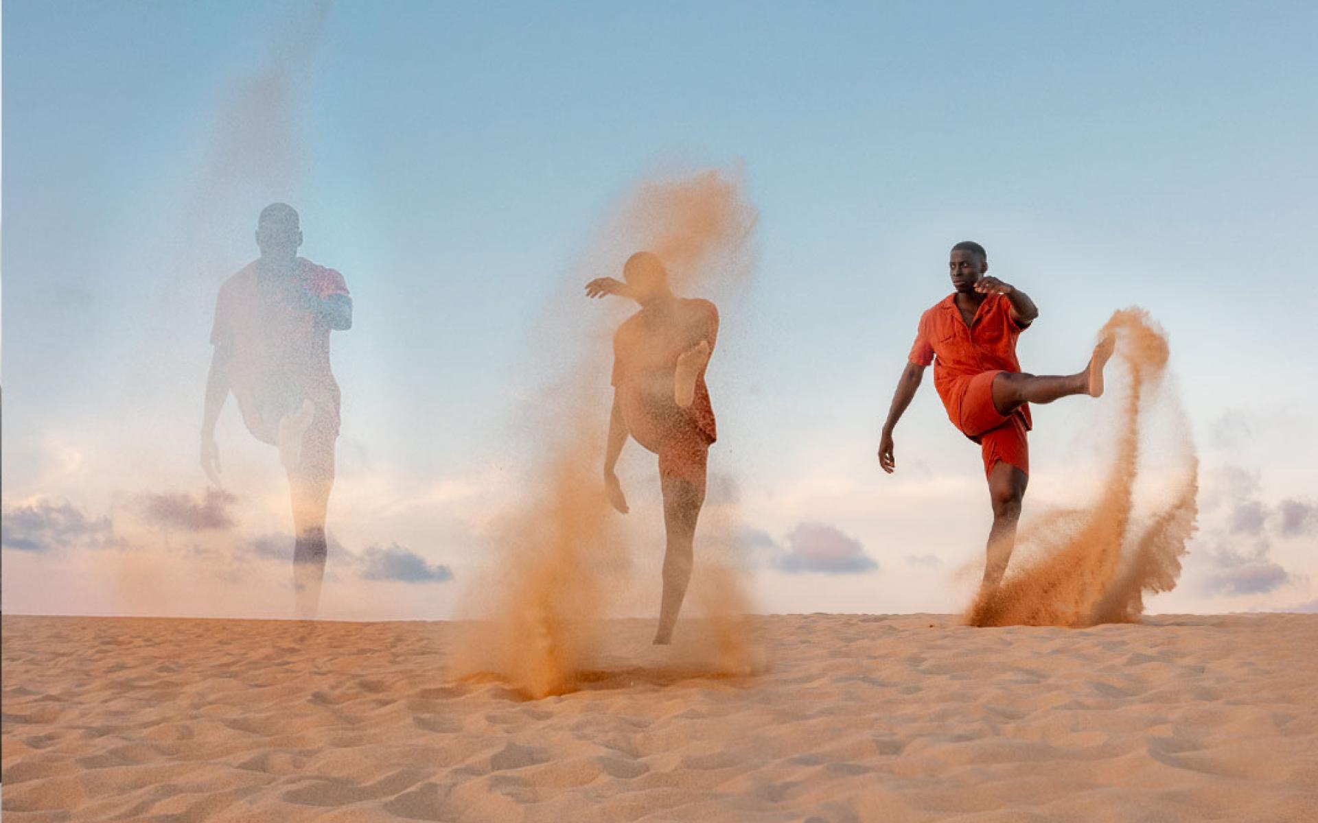 Man kicking sand